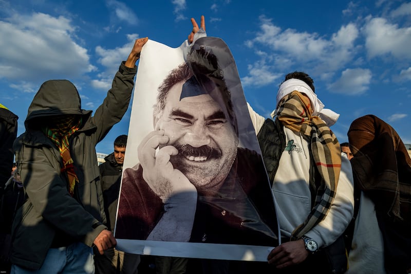 Kurds hold a photograph of jailed leader Abdullah Ocalan. Photograph: Metin Yoksu/AP