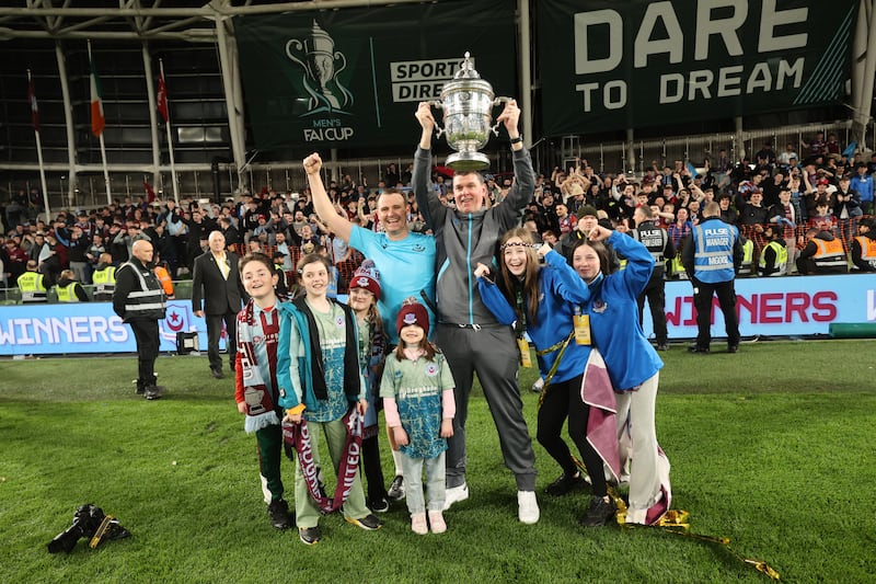 Drogheda United manager Kevin Doherty and assistant manager Daire Doyle celebrate with their families after the FAI Cup final. Photograph: Bryan Keane/Inpho