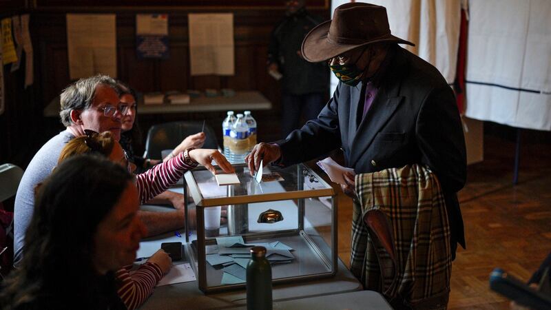 A man casts his vote in the second round of the French presidential election in Marseille, southern France Sunday, April 24, 2022. Photograph: Daniel Cole