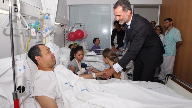 King Felipe VI of Spain speaks to Irishman  Norman Potot who was injured in  last Thursday’s terrorist attack. Photograph: Getty