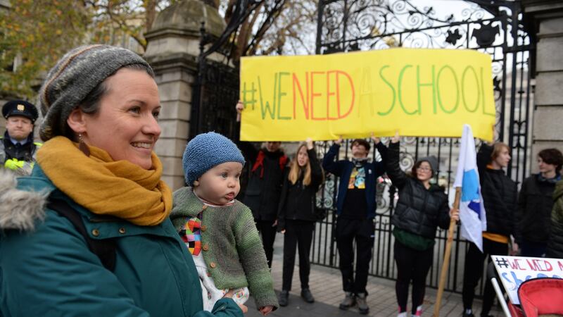 Kate Minnock, teacher with her daughter Fiadh joined students, teachers and parents from North Wicklow Educate Together Secondary School protest outside Leinster House, Dublin. Photograph: Dara Mac Dónaill / The Irish Times