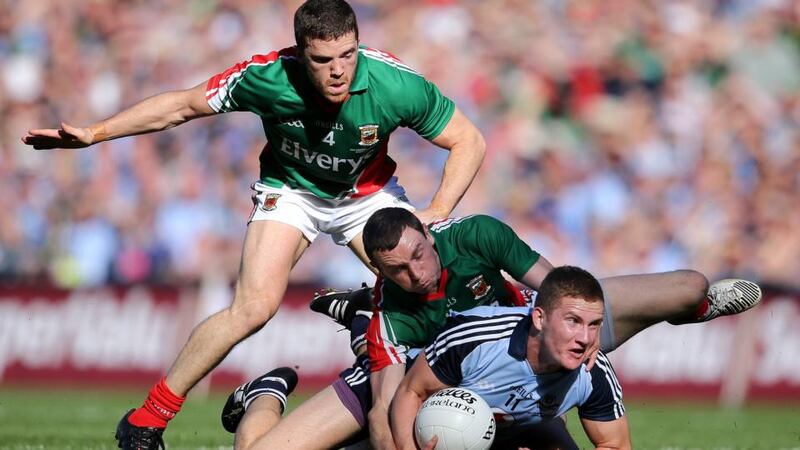 Mayo’s Chris Barrett and Keith Higgins tackle Ciarán Kilkenny of Dublin during the All-Ireland SFC final at Croke Park. Photograph: Cathal Noonan/Inpho