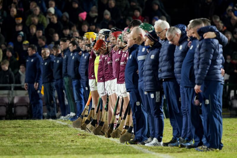 Galway players and backroom staff stand for a minute's silence for former Galway All-Ireland winning hurler Michael Coleman, who died in an accident at his home on Friday evening. Photograph: James Crombie/Inpho