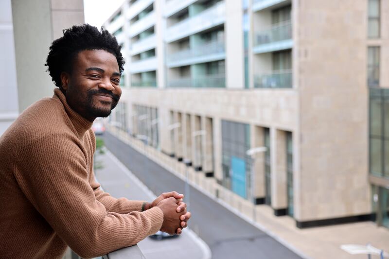 Joshua Manuel-Oni at his home in north Dublin: 'Things have always felt temporary.' Photograph: Dara Mac Dónaill/The Irish Times