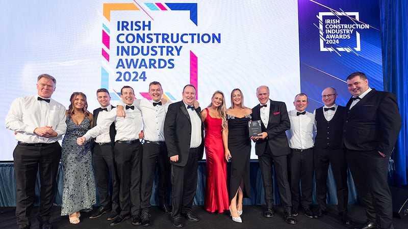 Richie Smith, business development director at BWDI Ltd, presents the contractor of the year award to the Boyle Construction team