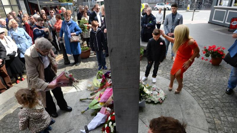 Relatives lay wreaths at the monument to commemorate the Dublin and Monaghan bombings on Talbot Street, Dublin. Photograph: Cyril Byrne/The Irish Times