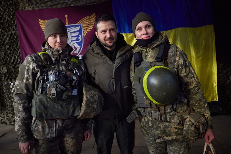 Ukrainian servicewomen with president Volodymyr Zelenskiy. Photograph: Ukrainian Presidential Press Office/AP