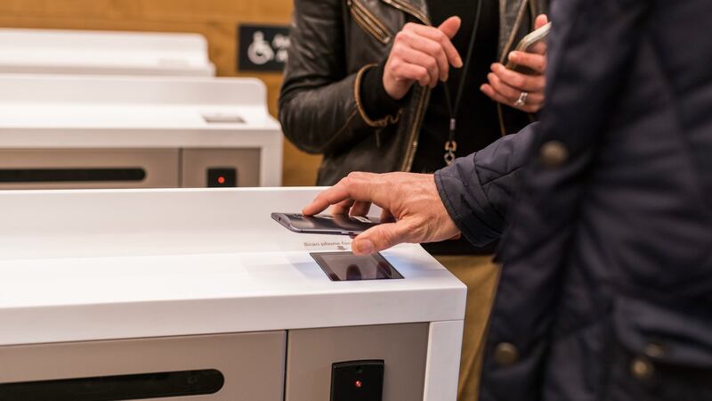 Nick Wingfield, a technology correspondent for The New York Times, uses his phone to enter the Amazon Go store in Seattle, Jan. 16, 2018. The technology inside the new convenience store, opening Jan. 22, 2018 in Seattle, enables a shopping experience like no other Ñ including no checkout lines. (Kyle Johnson/The New York Times)