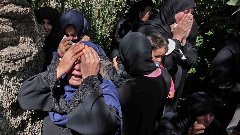 Relatives of  27-year-old Palestinian farmer Omar Samour, who was killed   by Israeli tank fire. Photograph: Said Khatib. AFP/Getty Images