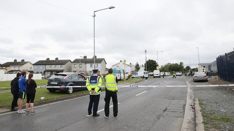 Gardaí at the scene of the double murder in Ballymun, Dublin on Wednesday evening. Photograph: Brian Lawless/PA Wire