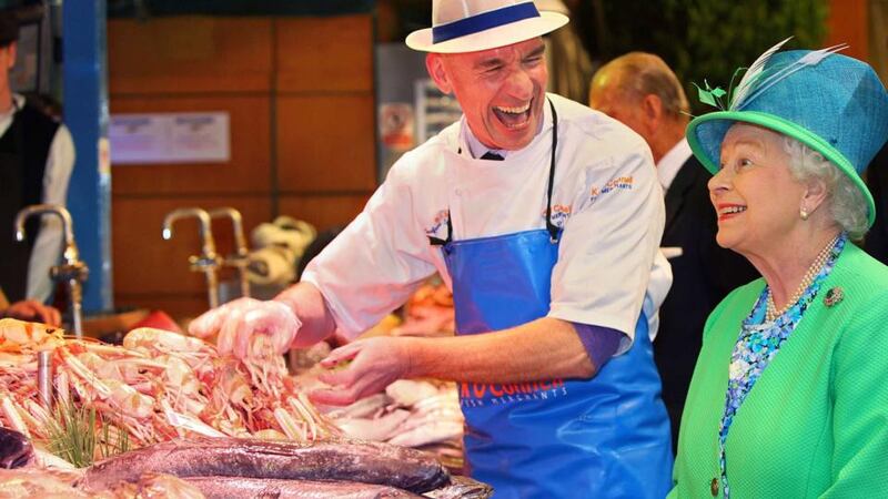 Queen Elizabeth has fishmonger Pat O’Connell laughing at the English Market, Cork, in 2011. Photograph: Reuters/Maxwell’s/Pool