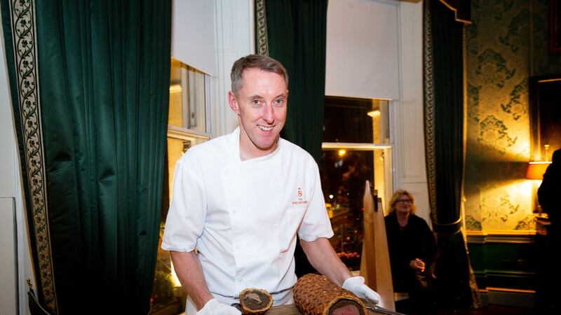 Executive chef  Garry Hughes carving  beef Wellington tableside.