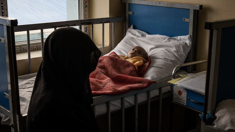 Women tending to recovering children in the malnutrition ward of the Indira Gandhi Children’s Hospital in Kabul. Photograph: Jim Huylebroek/New York Times