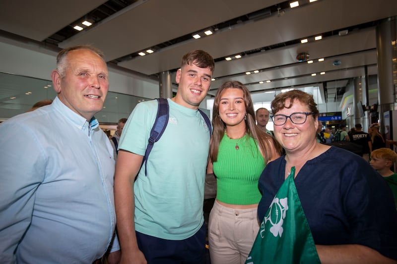 James McNabney from the Ireland Under-20s rugby team with his parents, Lucinda and Howard McNabney, and his girlfriend, Felicity McConnell, at Dublin Airport. Photograph: Tom Honan