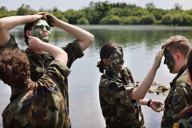 Getting stuck in with camouflage paint. Photograph: Dara Mac Dónaill







