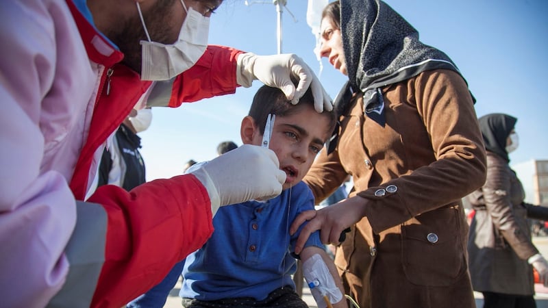 A wounded boy is treated following an earthquake in Sarpol-e Zahab county in Kermanshah, Iran. Photograph: Tasnim News Agency