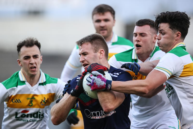 Loughmore-Castleiney's John McGrath is tackled by Tadhg Condon, Joe Higgins and Ross Peters of Clonmel Commercials in this year's football county final. Photograph: Ben Brady/Inpho