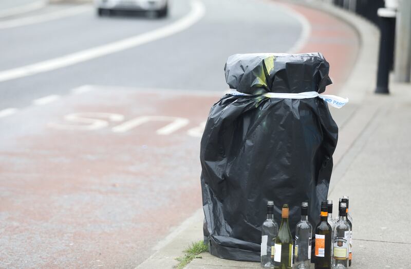 Empty bottles beside a taped-closed litter bin in Dublin as extra security precautions are put in place ahead of the visit of US president Joe Biden. Photograph: Leah Farrell / RollingNews.ie