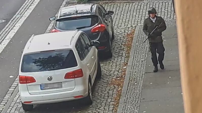 The suspected shooter walking along a street in Halle, Germany, in this screenshot from ATV-Studio Halle video. Photograph: Andreas Splett/ATV-Studio Halle/AFP via Getty Images