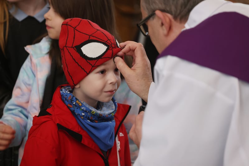 Eight–year–old Maciej Wasik from the Central Model School in Marlborough Street, Dublin, at the Pro Cathedral receiving ashes to mark the first day of Lent. Photograph: Bryan O’Brien 