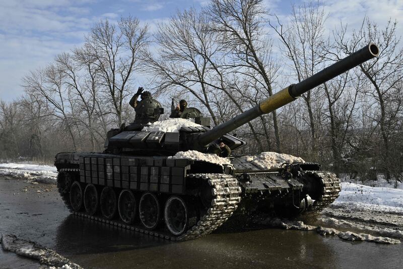 Ukrainian servicemen ride on a tank near Bakhmut, Donetsk region, amid the Russian invasion of Ukraine. Photograph: Genya Savilov/AFP via Getty Images