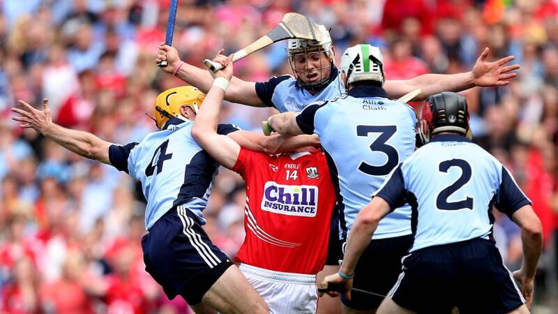 Dublin’s Paul Schutte, Peter Kelly, Niall Corcoran and Liam Rushe with Patrick Horgan of Cork at Croke Park.  Photograph: James Crombie/Inpho