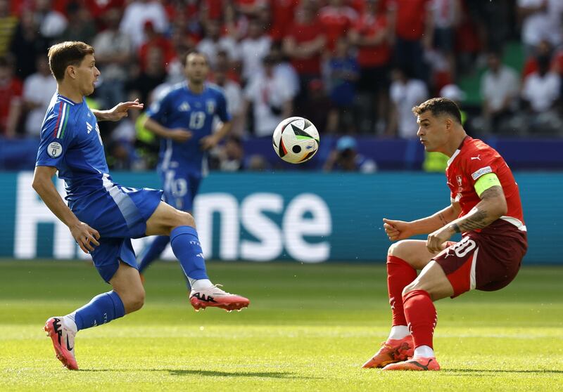 Italy's Nicolo Barella is challenged by Switzerland's Granit Xhaka during the game in Berlin. Photograph: Robert Ghement/EPA