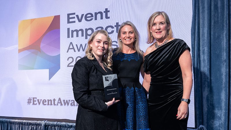 Maria Roddy Freyne, awards judge, presents the best awards ceremony award to Niamh Mc Dermott and Sinead Mitchell, Guaranteed Irish Business Awards