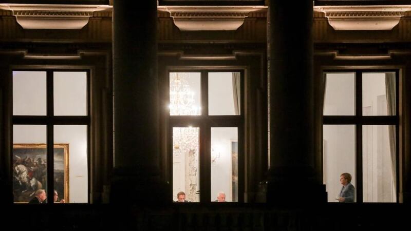 Berlin deadlock: German chancellor Angela Merkel (right) in the 15-hour marathon talks session with Greens and Free Democrats. Photograph: Kay Nietfeld/AFP/Getty