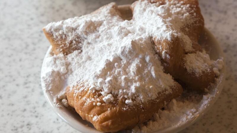 Sugary beignets at Cafe Du Monde in the  French Quarter, New Orleans