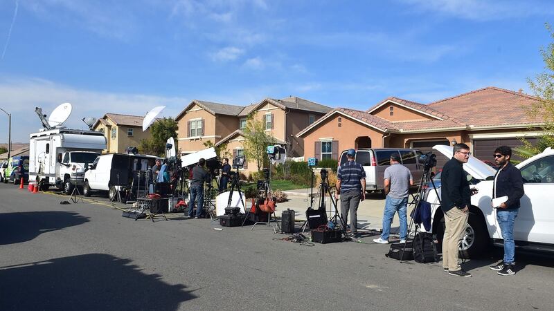 Media gather in front of the home of David Allen Turpin and Louise Anna Turpin who have been arrested for torture over their treatment of their children. Photograph: Frederic Brown/AFP/Getty.