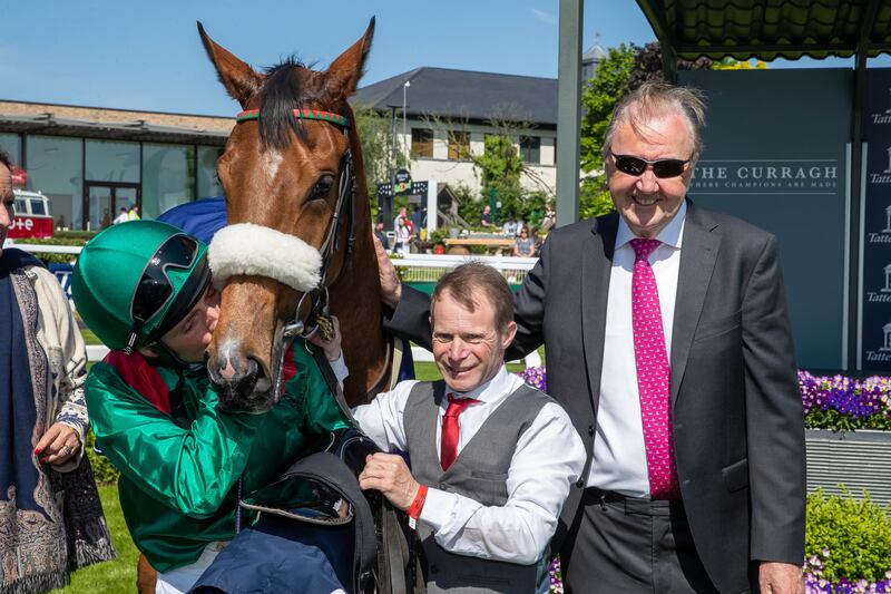 Jockey Chris Hayes, groom David Glennon and trainer Dermot Weld celebrate winning the Irish 1,000 Guineas win with Tahiyra. Photograph: Morgan Treacy/Inpho