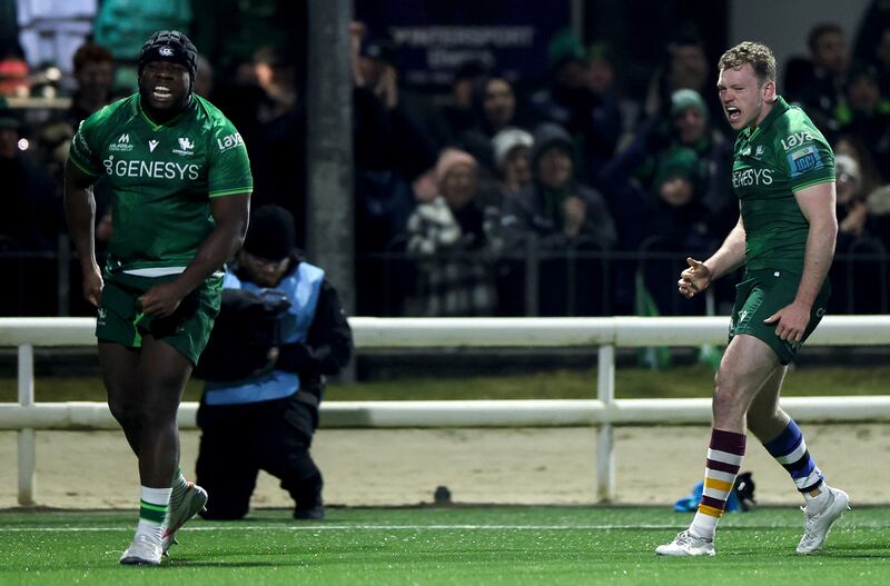 Connacht’s Sam Illo and Cathal Forde celebrate Dylan Tierney-Martin’s late try. Photograph: James Crombie/Inpho