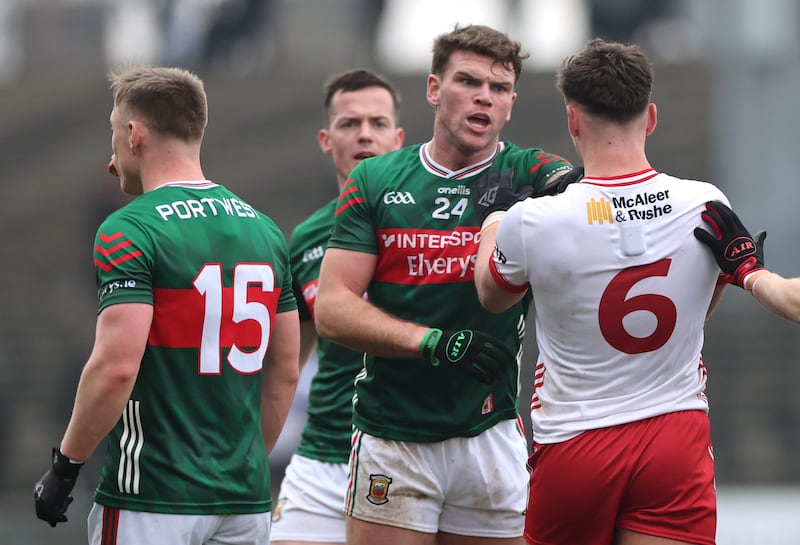 Mayo’s Jordan Flynn argues with Tyrone's Michael McKernan. Photograph: James Crombie/Inpho