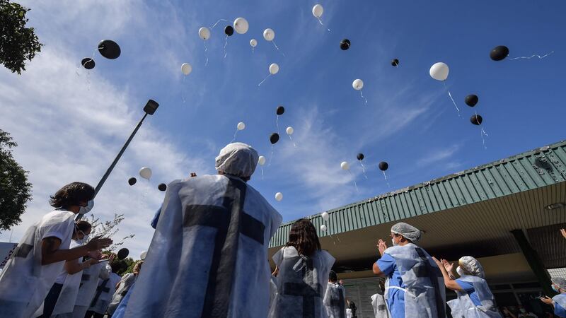 Healthcare workers in Sao Paulo release balloons in honour of colleagues whohave died of coronavirus. Photograph: Nelson Almeida/Getty/AFP