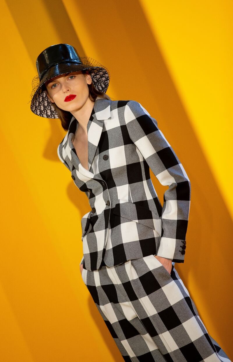 Polina Sova wears Dior Check Jacket €3,100 Dior Trousers, Dior Hat €650, Dior Shoes. Photograph: Tom Honan