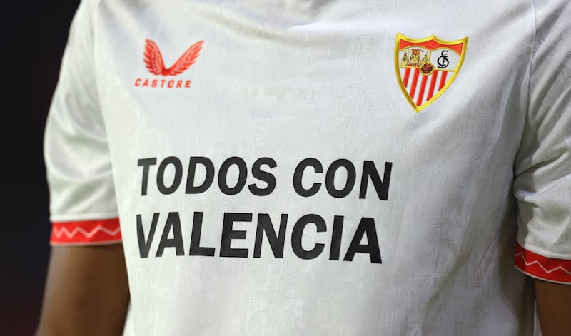 A detailed view of the message "All With Valencia" on the front of the match shirt during the La Liga match between Sevilla FC and Real Sociedad at Estadio Ramon Sanchez Pizjuan. Photograph: Fran Santiago/Getty