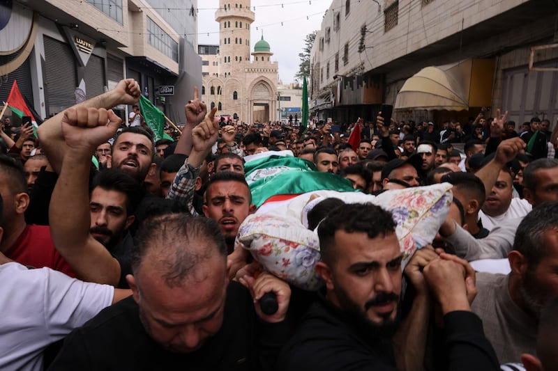 Mourners carry the body of Palestinian protester Muhammed Jawad Zughayer (21) who was killed in clashes with Israeli forces. Photograph:   Hazem Bader/AFP via Getty Images