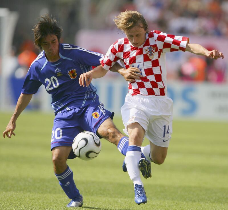 Luka Modric of Croatia is tackled by Keiji Tamada of Japan during the 2006 World Cup. Photograph: Mike Hewitt/Getty