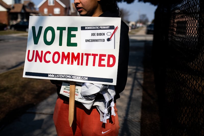 A canvasser’s sign urges voters to cast an uncommitted ballot during the state’s presidential primary election day on February 27th, 2024. Photograph: Emily Elconin/The New York Times
                      