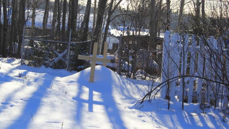 The dead are buried beside their houses in Pikangikum, so crosses dot the landscape, a stark reminder of those who in many cases young. Photograph: Jennifer Hough