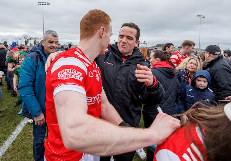 Louth’s Donal McKenny celebrate with manager Ger Brennan after the win over Meath in Inniskeen. Photograph: James Crombie/Inpho