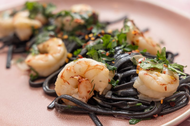 Prawn linguine with squid ink pasta. Photograph: Harry Weir 