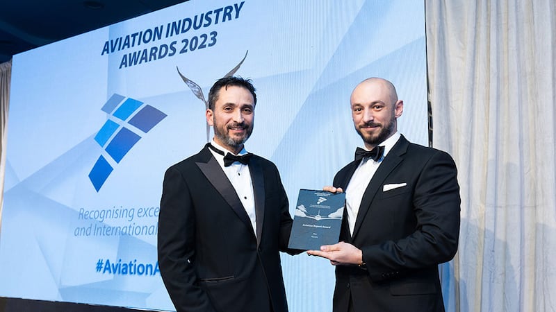 Rick Livingstone, awards judge, presents the aviation export award to Guillaume Riggi, Aterim