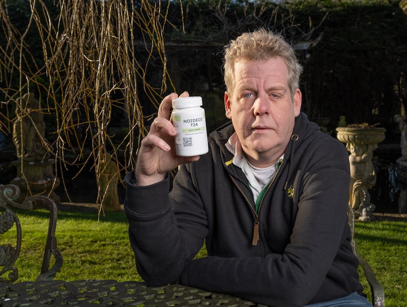 Jason Pickering with a container of his prescribed medicinal cannabis. Photograph: Jon Rowley/The Irish Times