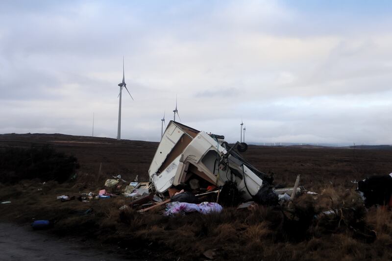 A caravan, upturned by the storm, lies destroyed beside a wind farm in Spiddal, Co Galway. Photograph: Ronan McGReevy