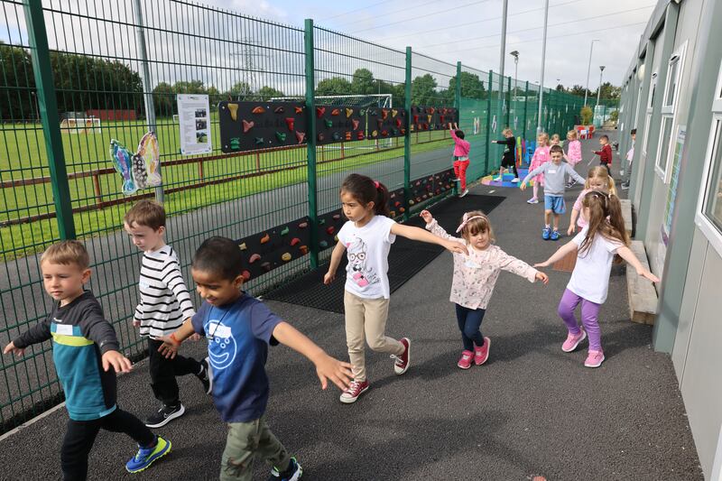 Junior infants in the yard on their first day at school in Leixlip Educate Together National School, Leixlip, Co Kildare. Photograph: Dara MacDónaill/The Irish Times 








