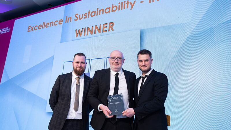 Ivan Mannion, director - business development at Sensori Facilities Management, presents the Excellence in Sustainability - In-House award to Shane Faulkner and Andrew Fay, KPMG.