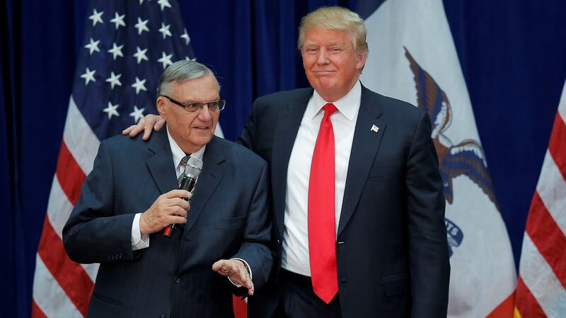 Donald Trump is joined onstage by former Maricopa county sheriff Joe Arpaio (Left) at a campaign rally in Marshalltown, Iowa in 2016, after Arpaio endorsed  Mr Trump’s candidacy.