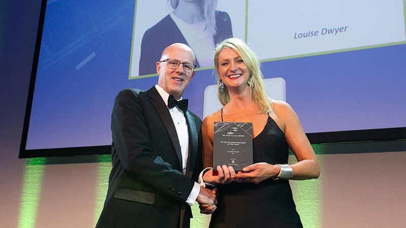 Matt Mohan, CEO, The FKM Group presents the Fit Out Project Manager of the Year award to Louise Dwyer, JLL.